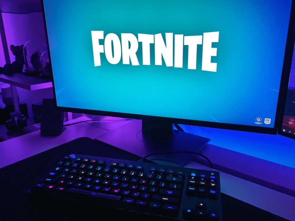 Fortnite Season on black flat screen computer monitor with black computer keyboard