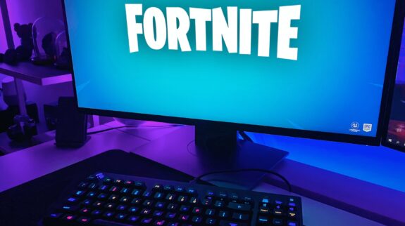 Fortnite Season on black flat screen computer monitor with black computer keyboard
